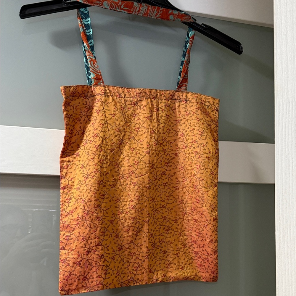 Silk, Made in India Orange Patterned Reversible Tote Bag
NWOT 12 x 15”